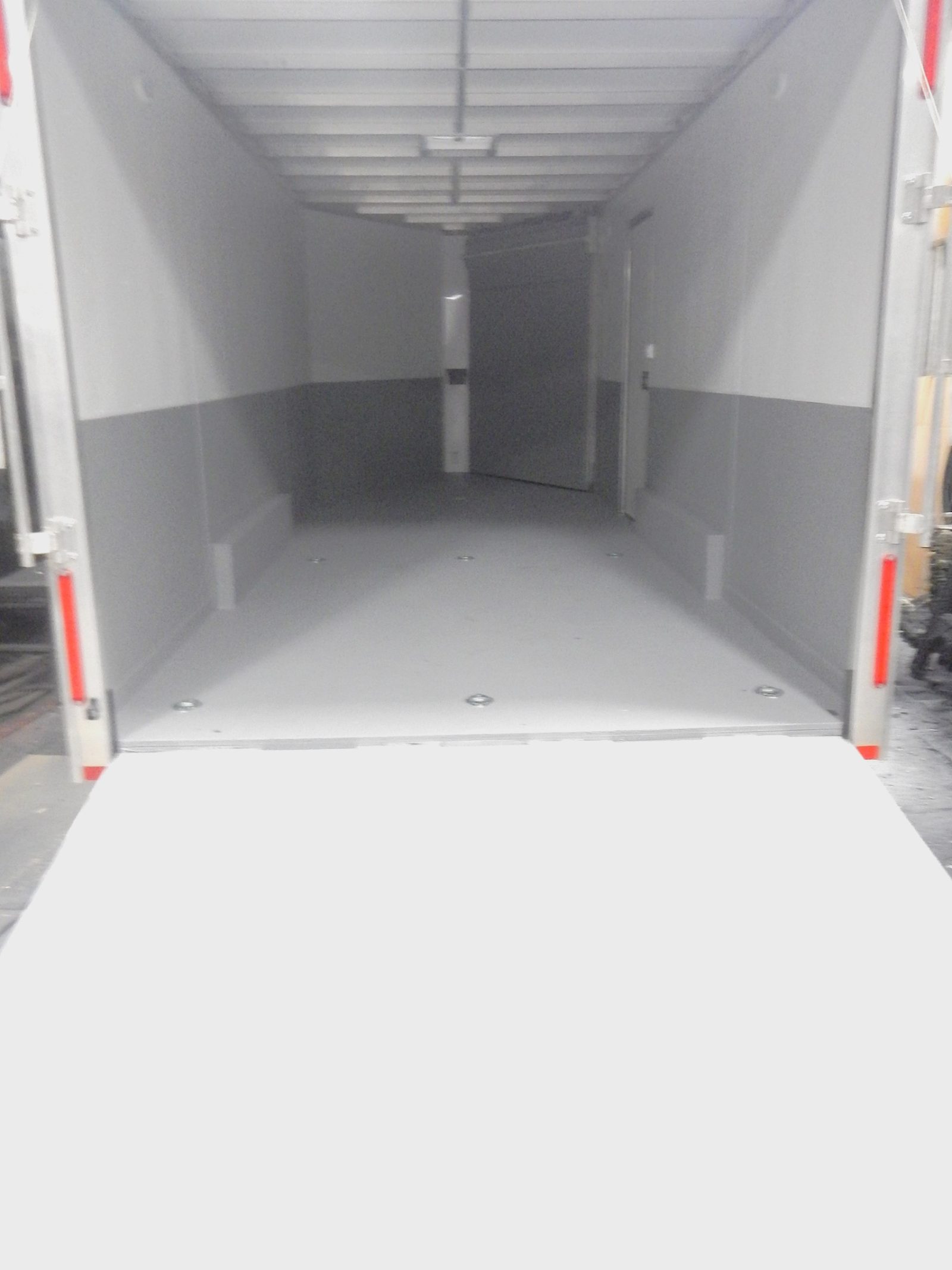 Trailer roof seams detail-coated before field coating